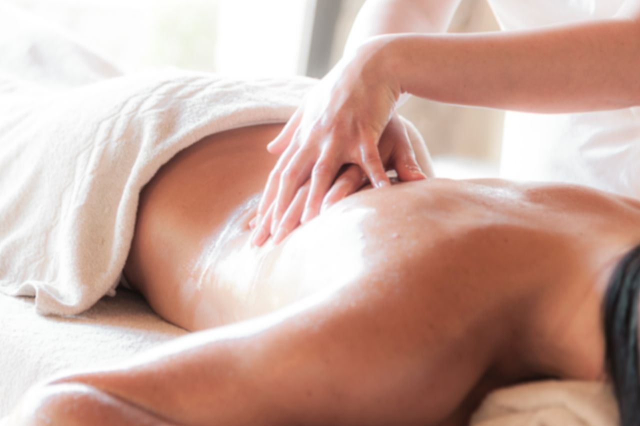 Home A soothing massage session in a serene spa environment promoting relaxation and wellness.