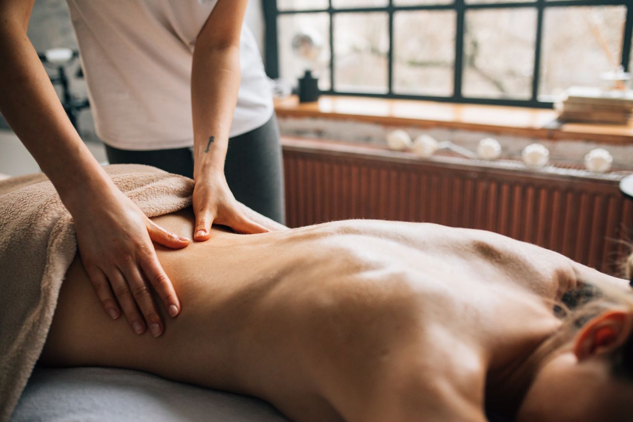 Home A soothing massage session in a warm indoor setting promoting relaxation and self-care.